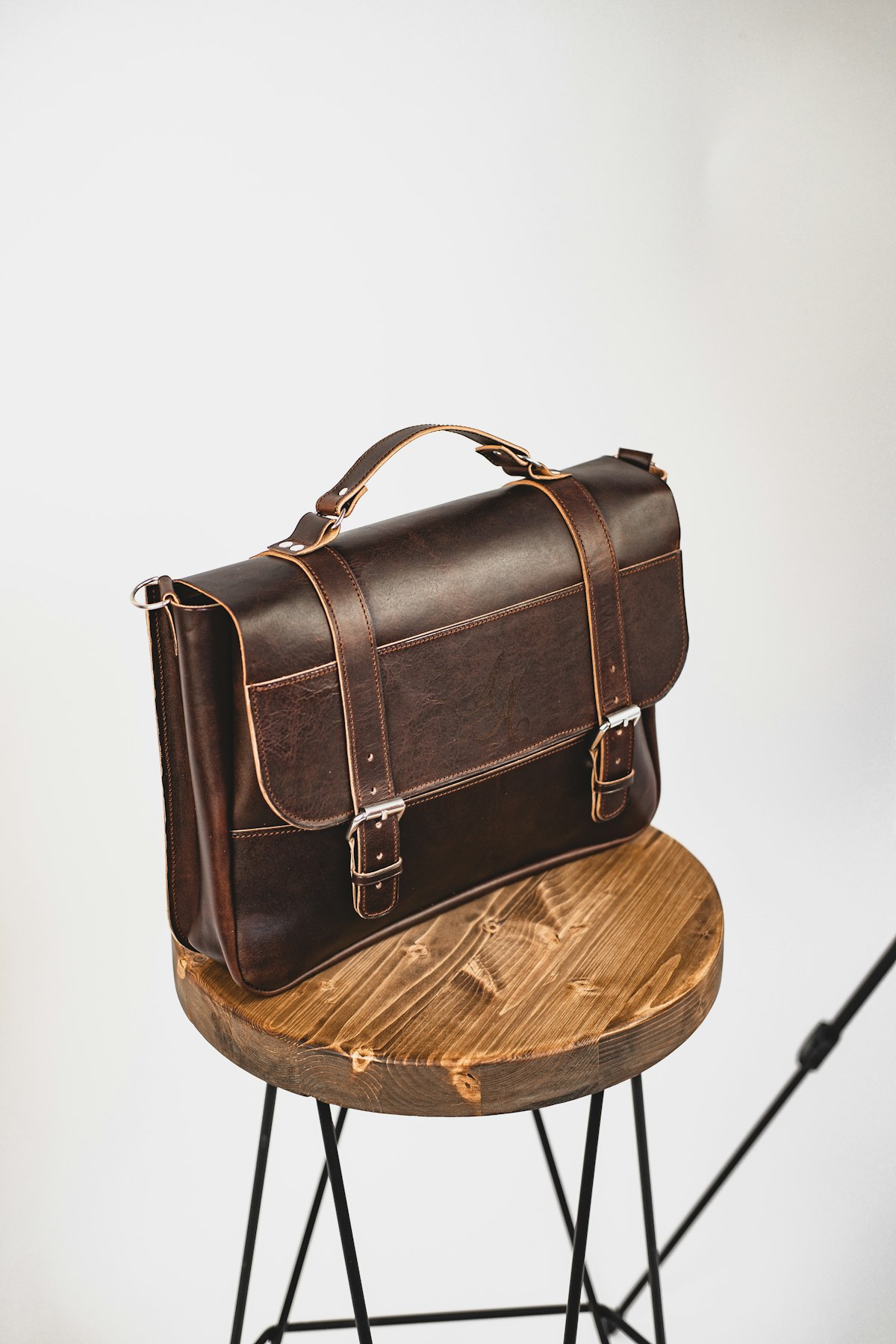 Detail of a leather brief, hand-stitched in chestnut bridle