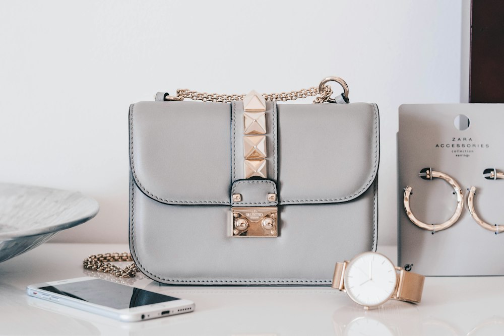 The Antwerp — a structured leather tote in chestnut bridle, photographed against a parchment backdrop.